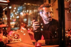 Customer scrolling past a restaurant website on a mobile phone