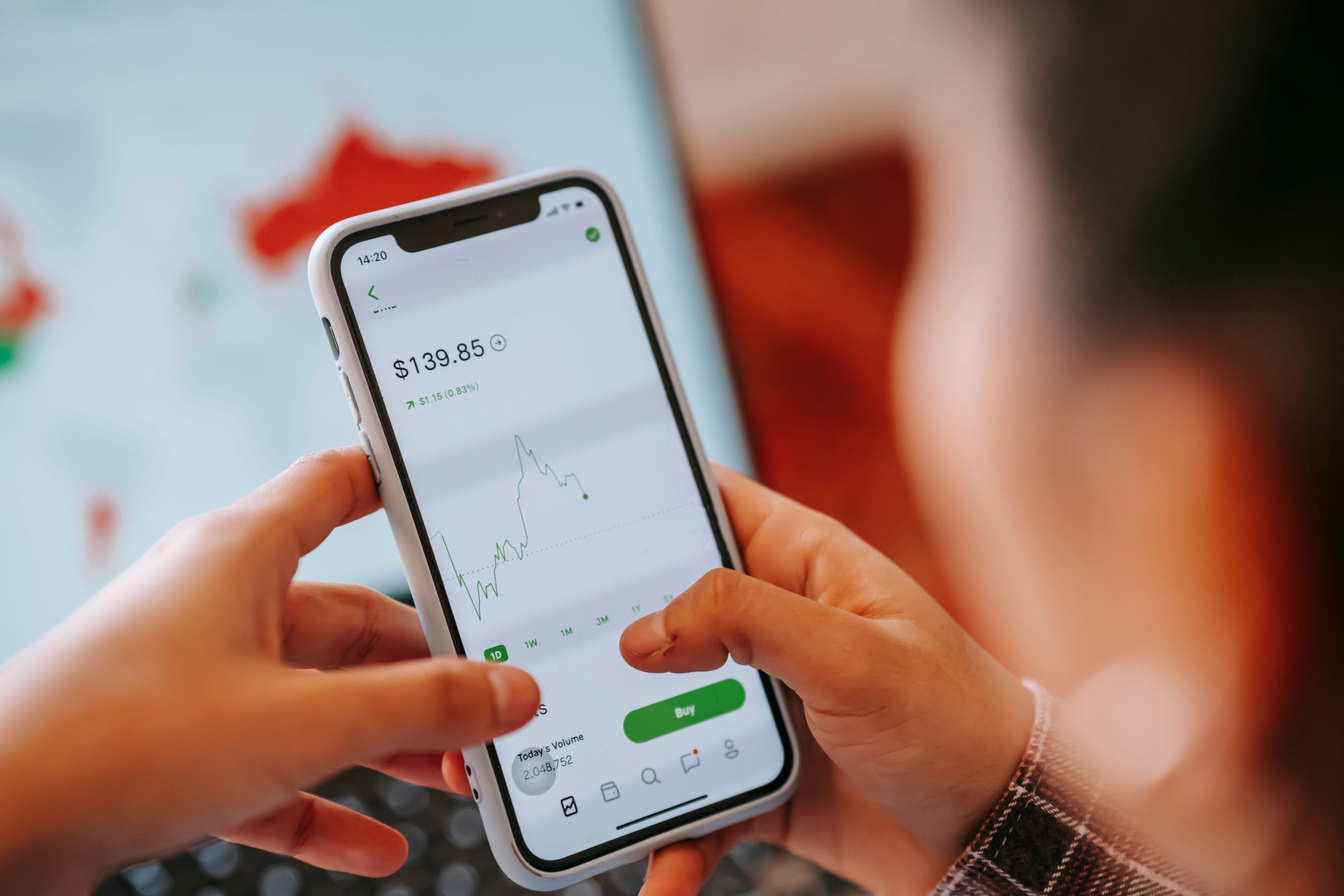 Restaurant owner checking estimated revenue on a phone